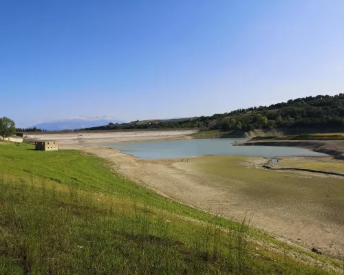 Beautiful landscape view with a dried-up dam and thickly growing trees in Penne, Abruzzo in Italy